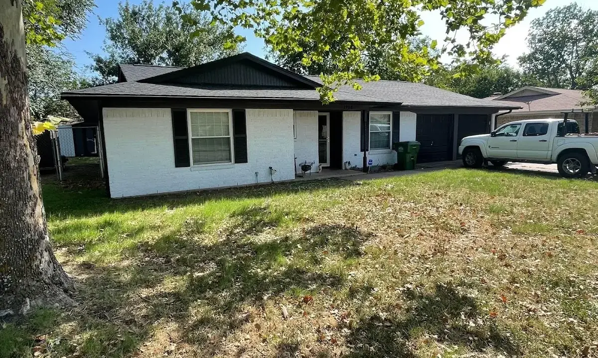 Professional roofing crew working on a residential roof in Fairfield
